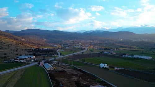 Rural Farmland With Distant Mountains Aerial View