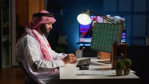 Man Working at Computer in Home Office