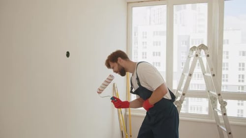 Man Dances While Painting Interior Room