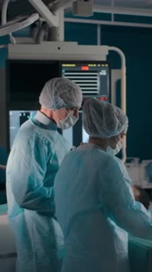 Medical Professionals Perform Surgery in Hospital Operating Room