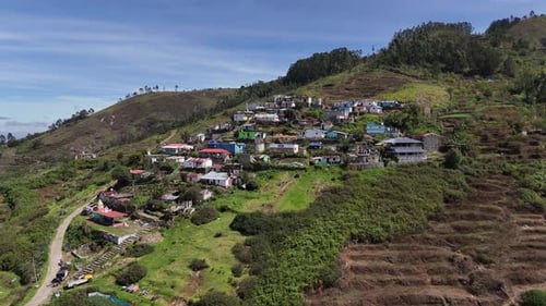 Stunning aerial of cloud banks drifting over mountain ridges in Kodaikanal.