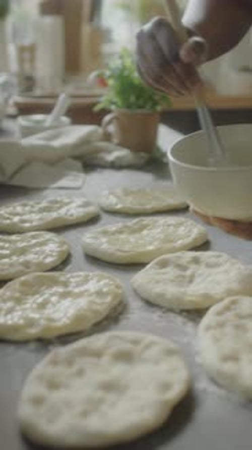 Applying Wash to Flattened Dough Pieces
