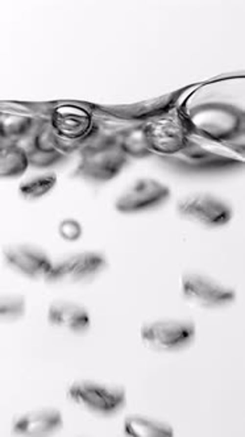 Boiling Water Bubbles Rising Up on Surface Closeup Vertical