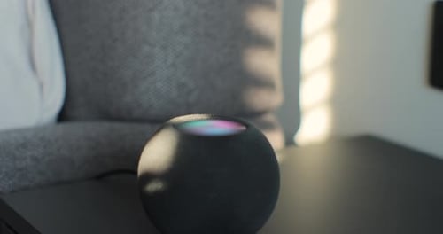 Round Smart Speaker Device on a Side Table