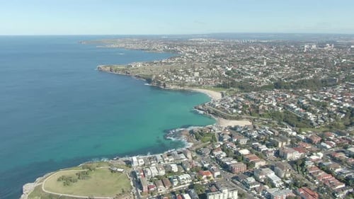 A aerial shot over rock pools to reveal Tamarama Beach. Sydney Australia.Aerial Drone Shot of Suburb