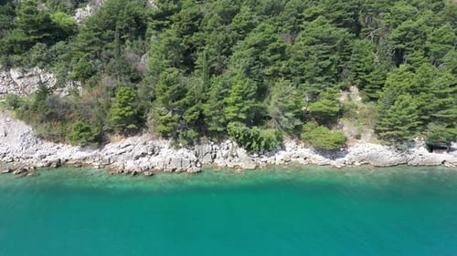 The drone flies over the sea. Beautiful clear water of the Adriatic Sea off the coast of Croatia.