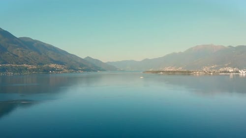 Wide aerial shot of Lake Maggiore, Italy. Pedestal shot of Lake Maggiore with the mountains in the b