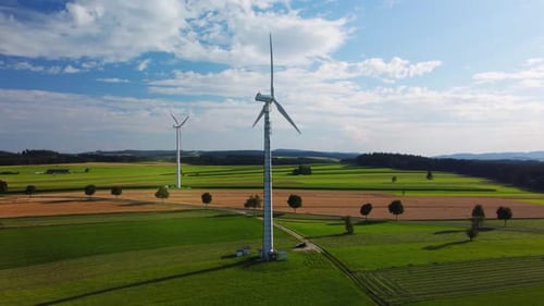 Aerial view of wind turbines on rural farmland