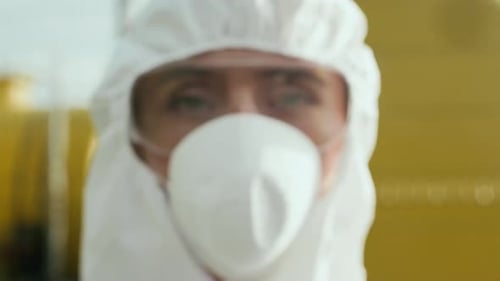 Adult in Hazmat Suit and Face Mask Close Up
