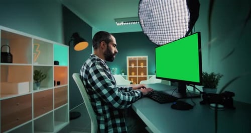 Young freelancer, copywriter, designer, editor or content creator working on desktop computer with c