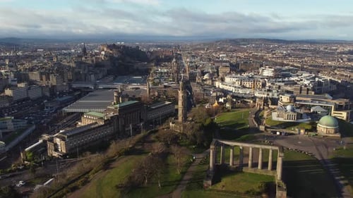 Aerial view from the top of Calton Hill in Edinburgh looking towards the city centre. Flying towards