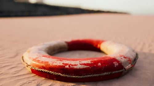 Lifebuoy on the City Beach at Sunset