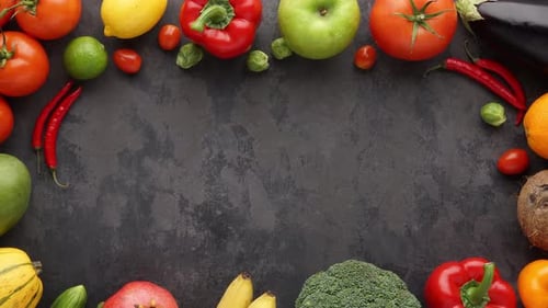 Fresh colorful fruits and vegetables frame overhead shot