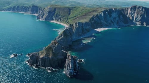 Aerial Panoramic View of Cliffs and Huge Rocks at Seaside and Waves Crashing to the Coast Beautiful