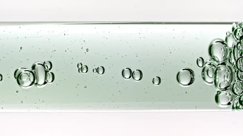 Bubbles moving in liquid in clear tube