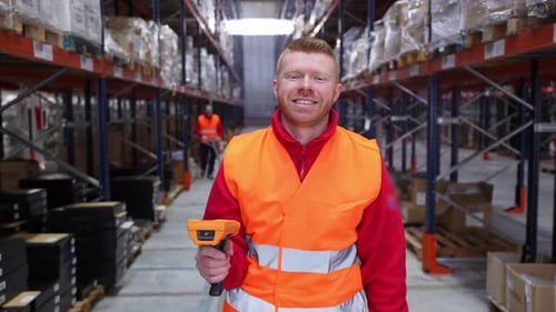 Warehouse Worker Scanning Inventory with Barcode Scanner