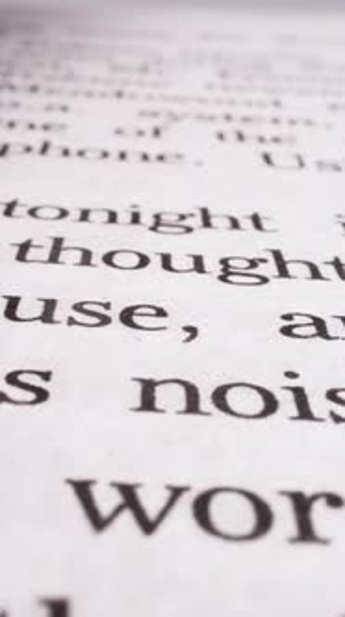 Page of Novel Book with Printed Text in Light Studio Macro