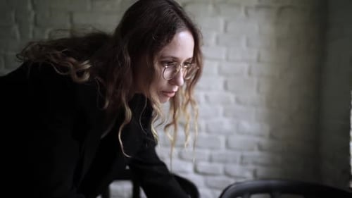 Young Woman Working on Her Laptop Computer in Coffee Shop