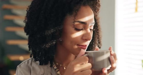 Woman Enjoys Morning Coffee in Sunlight