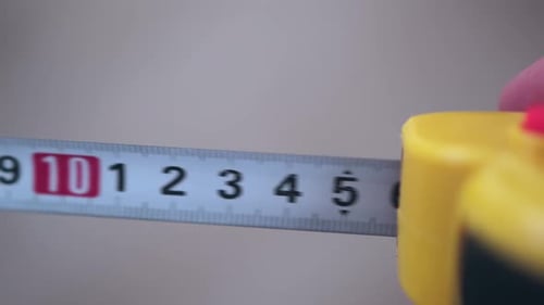 Close up of Tape Measure Being Extended