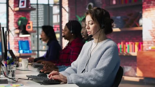 Call Center Team of Agents Wearing Headset Assisting Customers