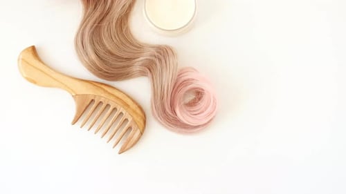 Hair Styling Products with Blonde and Pink Accents