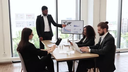 Business Professionals Meeting with Presentation in Modern Office