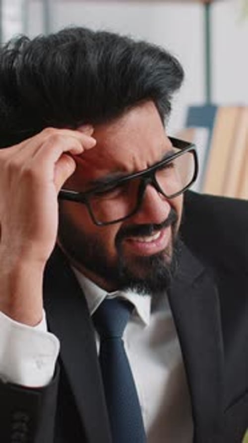 Tired Indian Business Man Suffering From Headache Problem Tension Migraine Stress at Home Office