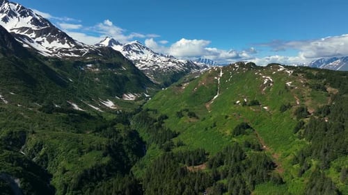Green Mountain Range And Valley Within The Kenai Fjords National Park In Summer In Alaska. - aerial