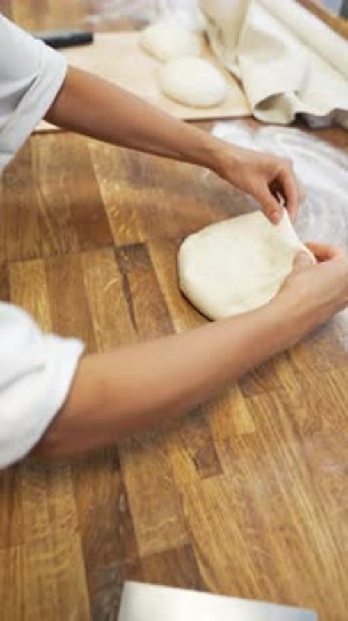 Forming Bread Using the Dough in the Bakery the Baker Continues