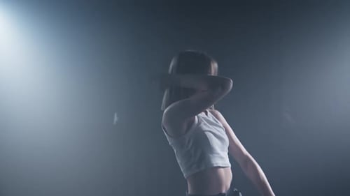 Graceful Female Dancing in Dark Room with Spotlights Sensual Woman Dancing
