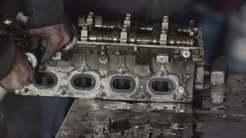 Manual Repair Of Car Engine Top Cover In Repair Shop