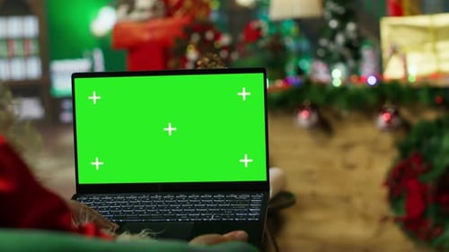 Santa Claus Looking at Letter Received From Kids on Green Screen Laptop