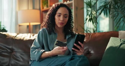 Woman with Credit Card Shopping Online at Home