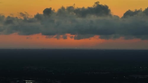 City Sunrise with Clouds and Orange Sky