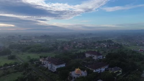 Aerial view, the morning view of the city of Yogyakarta and the magnificent Mount Merapi