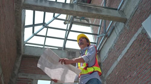 Portrait of engineers inspect and assess the residential home construction site's progress