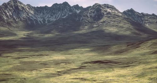 Majestic Mountain Landscape Showcasing Verdant Plains and Rugged Peaks