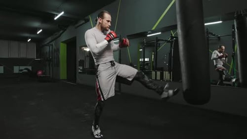 Young Man Boxing Workout in an Gym