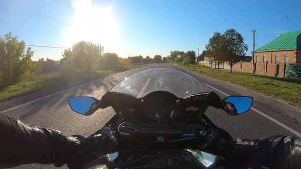 Point of View of a Motorcycle Rider Rides in Rural Road Through Village ...