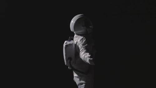 An astronaut in space floating around