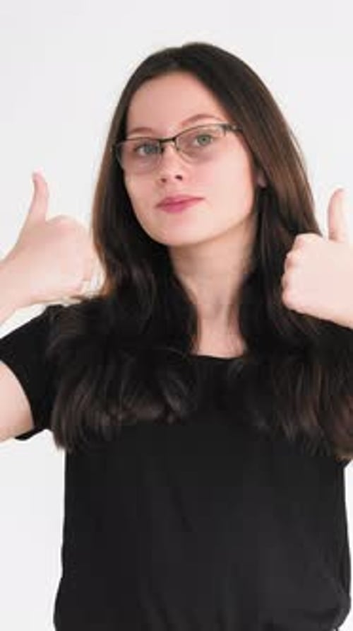 Young Woman Gives a Double Thumbs Up