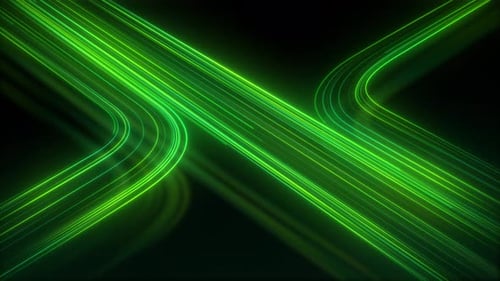 Green neon light trails glowing speed lines crossing dark background. Abstract luminous futuristic l