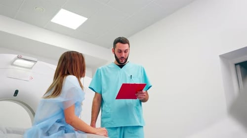 Healthcare Professional Discusses Scan Results with Patient