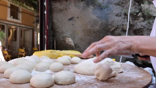 Hands Form Pieces of Dough for Baking Bread and Rolls