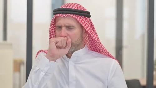 Arab Man Coughing in Office Environment