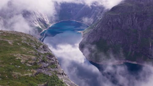 Beautiful nature Norway natural landscape Lovatnet lake flies above the clouds. fjords and mountains