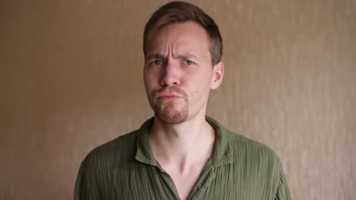 Man Looking Displeased in a Close Up Shot