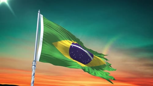 Weathered Brazilian Flag Waving Against Beautiful Sunset Sky