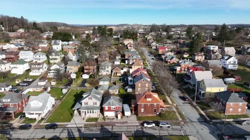 Aerial of small village town in USA. Beautiful colorful homes and houses during winter day.